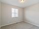 Neutral bedroom with carpeted floors, a window with blinds, and ample natural light at 26857 E Maple Ave, Aurora, CO 80018