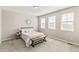 Bright bedroom with natural light, neutral decor, and a comfortable bed, creating a serene and inviting space at 26857 E Maple Ave, Aurora, CO 80018