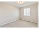 Neutral bedroom with carpeted floors, a window with blinds, and ample natural light at 26857 E Maple Ave, Aurora, CO 80018