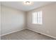 Neutral bedroom with carpeted floors, a window with blinds, and ample natural light at 26857 E Maple Ave, Aurora, CO 80018