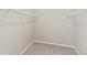 Empty walk-in closet with wire shelving and carpet at 26857 E Maple Ave, Aurora, CO 80018