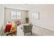 Comfortable living room with natural light, neutral decor, and cozy seating, perfect for relaxing and entertaining at 26857 E Maple Ave, Aurora, CO 80018