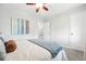 Bedroom with neutral walls, plush carpeting, and a doorway to another room at 500 S Decatur St, Denver, CO 80219