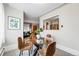 Bright dining room featuring a glass-topped table, neutral walls, and modern furnishings at 500 S Decatur St, Denver, CO 80219