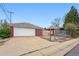 Spacious two car garage beside a fenced in backyard and home at 500 S Decatur St, Denver, CO 80219