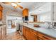 Functional kitchen with vintage appliances, wood cabinetry, and a seamless passthrough window at 500 S Decatur St, Denver, CO 80219