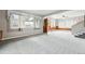 Spacious living room with neutral carpet, large windows and open entryway at 500 S Decatur St, Denver, CO 80219