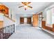 View of expansive living room featuring built-in shelving and an exterior door at 500 S Decatur St, Denver, CO 80219