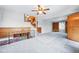Spacious living area with staircase, fireplace access, and adjacent room views at 500 S Decatur St, Denver, CO 80219