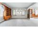 Spacious living room featuring built-in shelving and large windows at 500 S Decatur St, Denver, CO 80219
