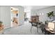 Spacious living room adjacent to kitchen and dining, featuring neutral decor and a cozy atmosphere at 500 S Decatur St, Denver, CO 80219