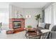 Inviting living room with a red brick fireplace, comfortable seating, and tasteful decor at 500 S Decatur St, Denver, CO 80219