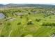 High definition aerial view of golf course with ponds and manicured green fields at 8100 W Quincy Ave # A8, Littleton, CO 80123