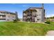 Attractive condo community featuring well-maintained landscaping, external stairs and neutral color palette at 8100 W Quincy Ave # A8, Littleton, CO 80123