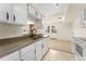 Well-designed kitchen with a view of the living area creating an open and connected living space at 8100 W Quincy Ave # A8, Littleton, CO 80123