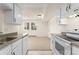 Efficient kitchen design provides an open concept with a pass through to the adjacent living space at 8100 W Quincy Ave # A8, Littleton, CO 80123