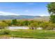 Peaceful view of the green landscape and lake at 8100 W Quincy Ave # A8, Littleton, CO 80123