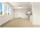 Neutral living room with bright natural light and open access to the kitchen through an open serving area at 8100 W Quincy Ave # A8, Littleton, CO 80123