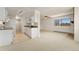 Inviting living space with an open floorplan featuring a fireplace and adjacent galley kitchen at 8100 W Quincy Ave # A8, Littleton, CO 80123