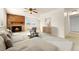 Staged lounge featuring fireplace, ample space and views to outside through windows and opening at 8100 W Quincy Ave # A8, Littleton, CO 80123