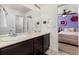 Bathroom with double sinks at 15446 Coopers Hawk Way, Parker, CO 80134