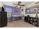 Bright bedroom featuring a race car theme, including a loft bed and a large decorative race car print at 15446 Coopers Hawk Way, Parker, CO 80134