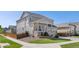 Corner lot with a well-maintained lawn, inviting front porch, and tasteful landscaping at 15446 Coopers Hawk Way, Parker, CO 80134