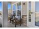 Charming front porch with comfortable seating and decorative stone accents at 15446 Coopers Hawk Way, Parker, CO 80134