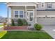 Inviting front porch with tasteful landscaping, charming flower boxes, and cozy seating at 15446 Coopers Hawk Way, Parker, CO 80134