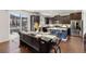 Modern kitchen featuring stainless steel appliances, granite countertops, and dark wood cabinetry at 15446 Coopers Hawk Way, Parker, CO 80134