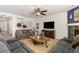 Spacious living room featuring a fireplace and comfortable seating arrangements at 15446 Coopers Hawk Way, Parker, CO 80134