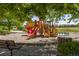 Community playground with multiple slides and play structures offers fun for children of all ages at 15446 Coopers Hawk Way, Parker, CO 80134