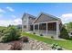 Great view of this home and backyard and how the covered porch lines up to the yard at 4565 Colorado River Dr, Firestone, CO 80504