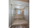 Modern shower with glass door, shower head, and bench seating at 4565 Colorado River Dr, Firestone, CO 80504
