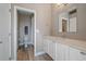 This bathroom boasts a toilet and bath/shower behind a partial wall, and sink with plenty of countertop space at 4565 Colorado River Dr, Firestone, CO 80504