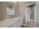 Well-lit bathroom features a modern vanity with white cabinets and a shower/tub combo at 4565 Colorado River Dr, Firestone, CO 80504