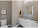 Elegant powder room with modern fixtures, vanity, mirror and decor at 4565 Colorado River Dr, Firestone, CO 80504