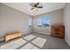 Spacious bedroom with large windows, ceiling fan, and plenty of natural light at 4565 Colorado River Dr, Firestone, CO 80504