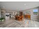 Open concept dining room with hardwood flooring and ample natural light at 4565 Colorado River Dr, Firestone, CO 80504