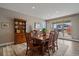 Cozy dining area with wood furniture, a window overlooking the backyard, and natural light at 4565 Colorado River Dr, Firestone, CO 80504