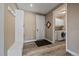 Functional mudroom entrance with storage, hooks, and access to laundry room at 4565 Colorado River Dr, Firestone, CO 80504
