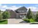 Charming two-story home with two-car garage and welcoming front porch at 4565 Colorado River Dr, Firestone, CO 80504