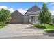 Beautiful front exterior of home with well-maintained landscaping at 4565 Colorado River Dr, Firestone, CO 80504