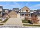 Charming two-story home with a well-manicured front yard and inviting covered porch at 4565 Colorado River Dr, Firestone, CO 80504