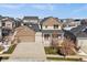 Charming two-story home with a well-manicured front yard and inviting covered porch at 4565 Colorado River Dr, Firestone, CO 80504