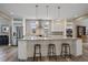 Modern kitchen with a large center island, pendant lighting, stainless steel appliances, and ample cabinet space at 4565 Colorado River Dr, Firestone, CO 80504