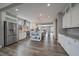 Spacious kitchen with stainless steel appliances, central island, and wood floors at 4565 Colorado River Dr, Firestone, CO 80504