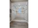 Luxurious walk-in shower featuring glass door, tiled walls, and a shower bench at 4565 Colorado River Dr, Firestone, CO 80504