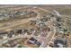 An aerial view highlights the layout of a suburban neighborhood, showcasing the road layout and house placement at 4807 River Highlands Loop, Elizabeth, CO 80107