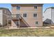 Back of house, featuring a well-maintained lawn, patio, and fenced yard at 4807 River Highlands Loop, Elizabeth, CO 80107